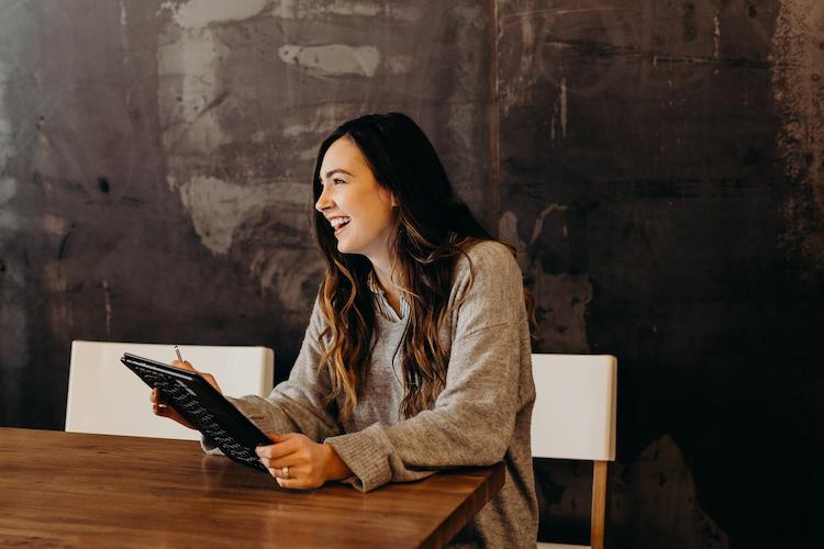 women smiling while working